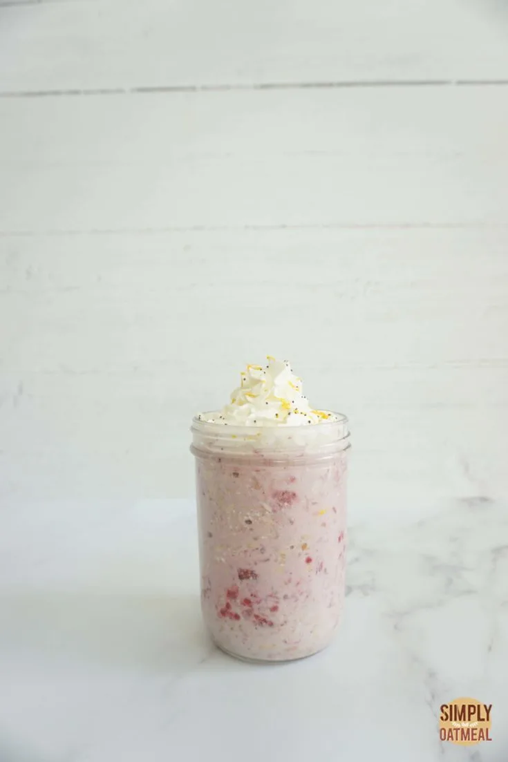 Single serving of lemon raspberry overnight oats in a mason jar.