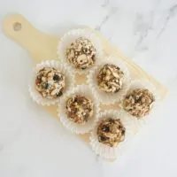 no bake blueberry muffin oatmeal balls on a wood plate