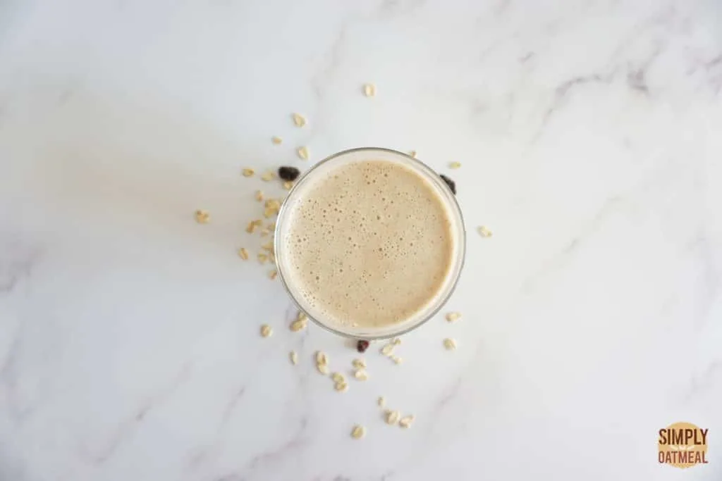 Oatmeal raisin cookie smoothie in a glass cup Oatmeal raisin cookie smoothie in a glass cup.