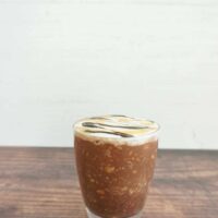 Glass jar with a serving of salted caramel mocha overnight oats.
