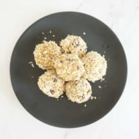 6 no bake peanut butter oatmeal balls on round black plate