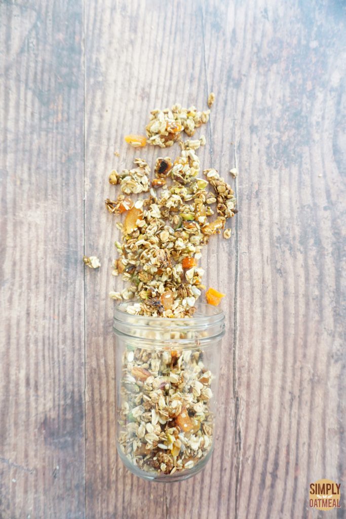 Apricot pistachio granola combines crushed pistachios, dried apricots, seeds and spice with rolled oats
