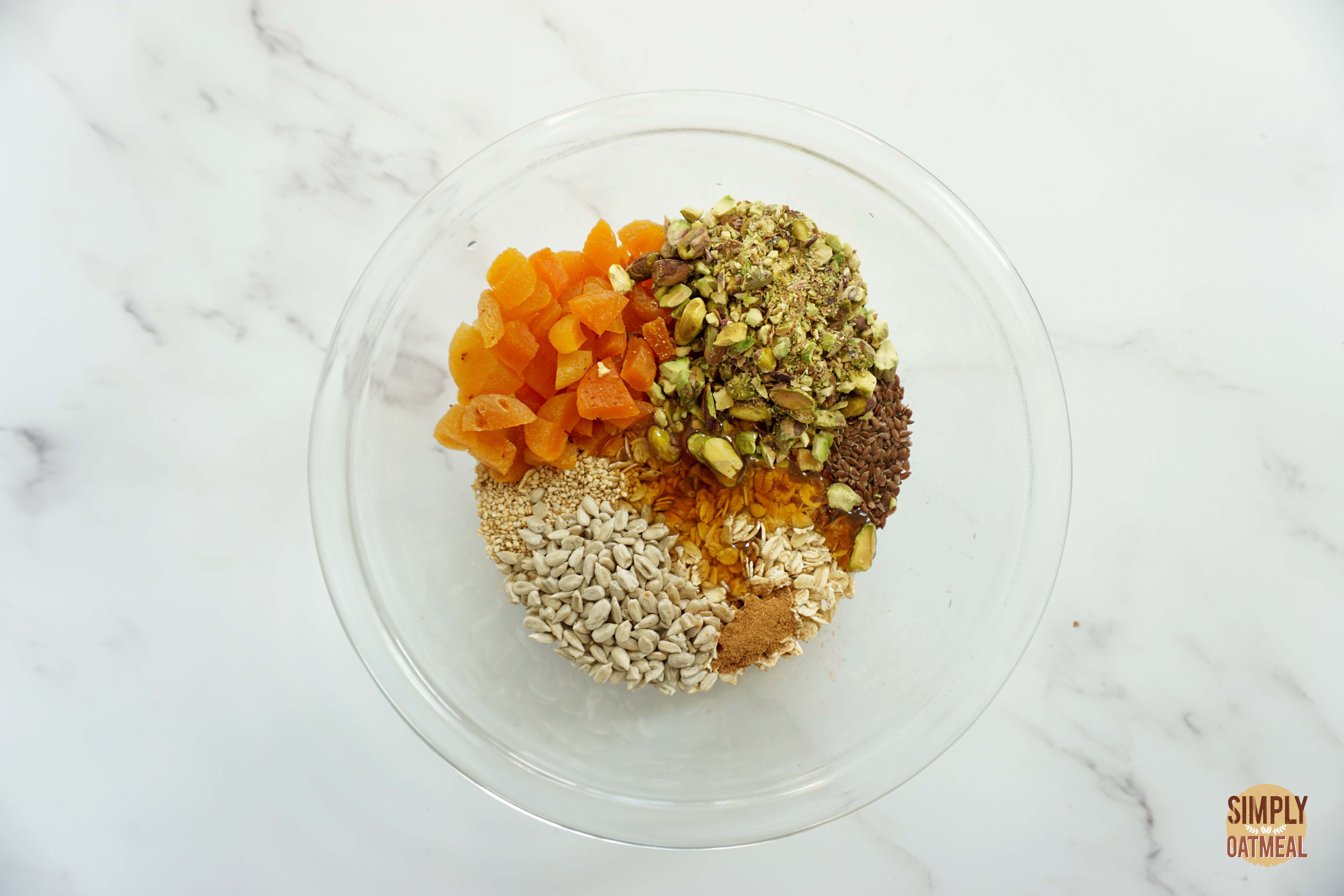 Wet and dry ingredients to make apricot pistachio granola