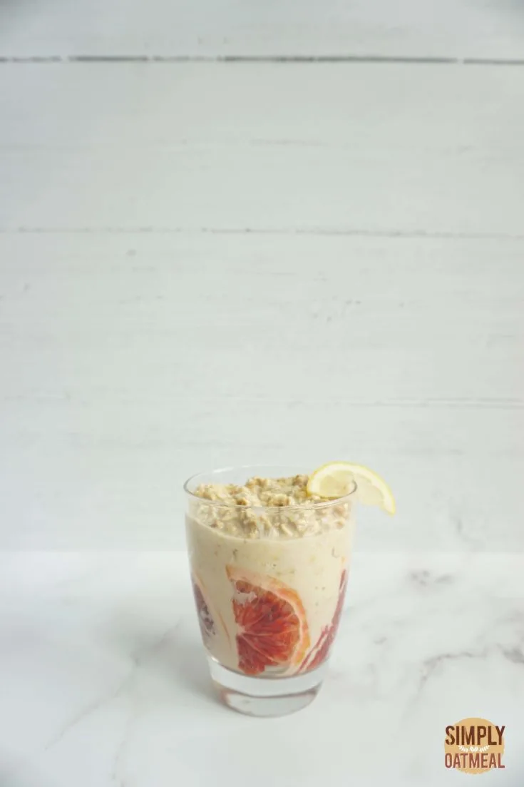 Single serving of blood orange lemonade overnight oats in a glass cup