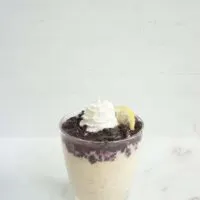 Single serving of blueberry lemonade overnight oats in a glass cup