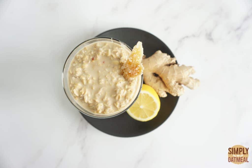 Gingerade lemonade overnight oats served in a mason jar and garnished with candied ginger.