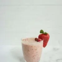 Single serving of pink lemonade overnight oats in a glass cup