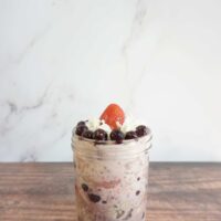 Single serving of strawberry blueberry overnight oats in a mason jar