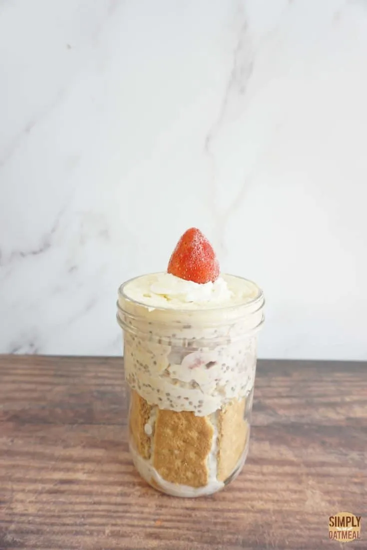 Single serving of strawberry cheesecake overnight oats in a mason jar