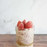 Single serving of strawberry chia overnight oats in a mason jar