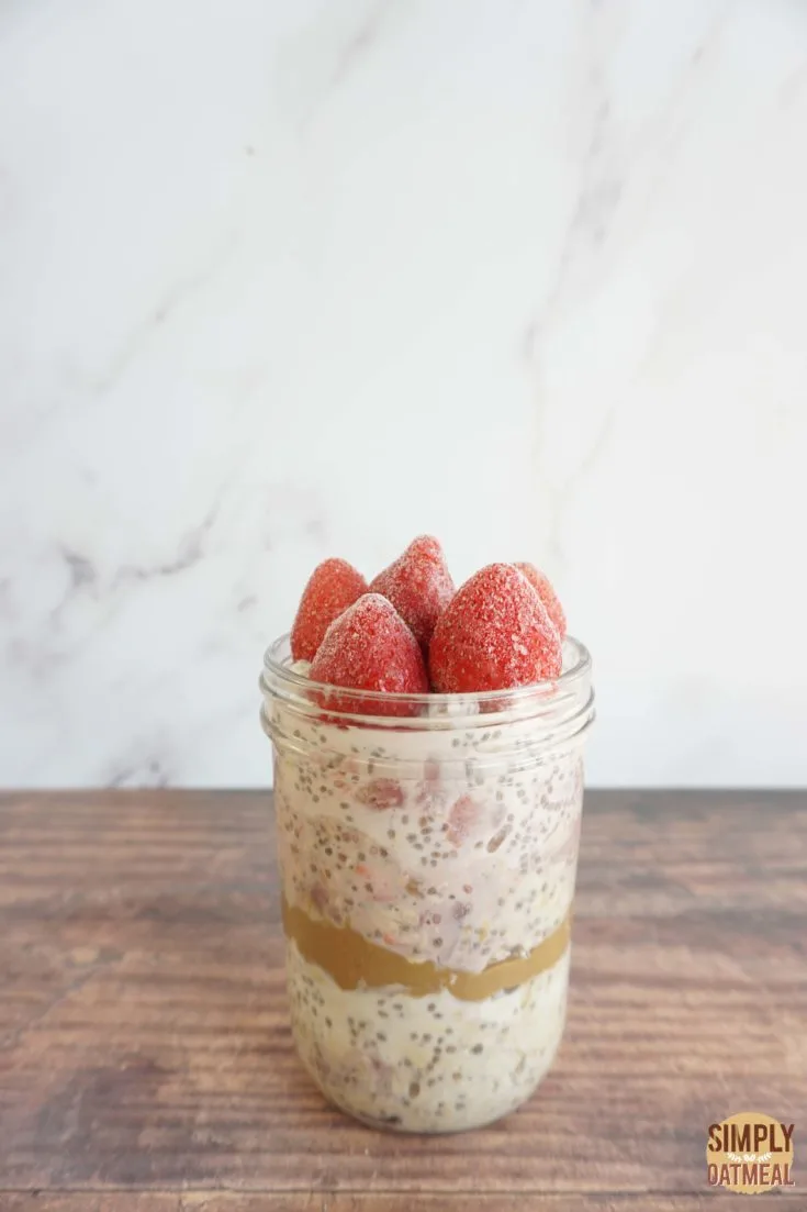 Single serving of strawberry chia overnight oats in a mason jar