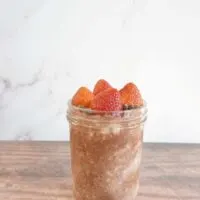 Singe serving of strawberry chocolate overnight oats in a mason jar