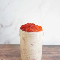 Single serving of strawberry cream cheese overnight oats in a mason jar