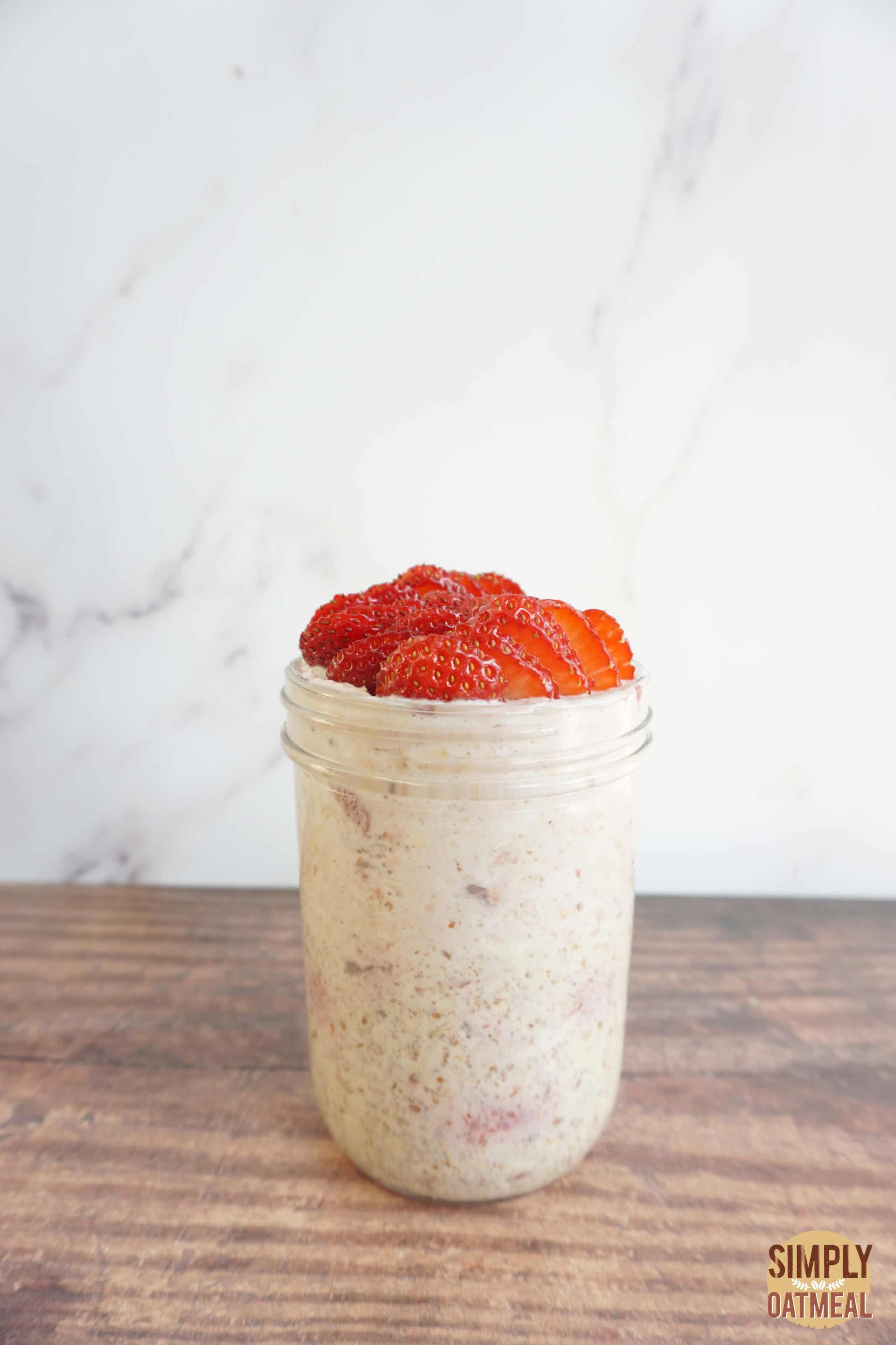 Single serving of strawberry cream cheese overnight oats in a mason jar