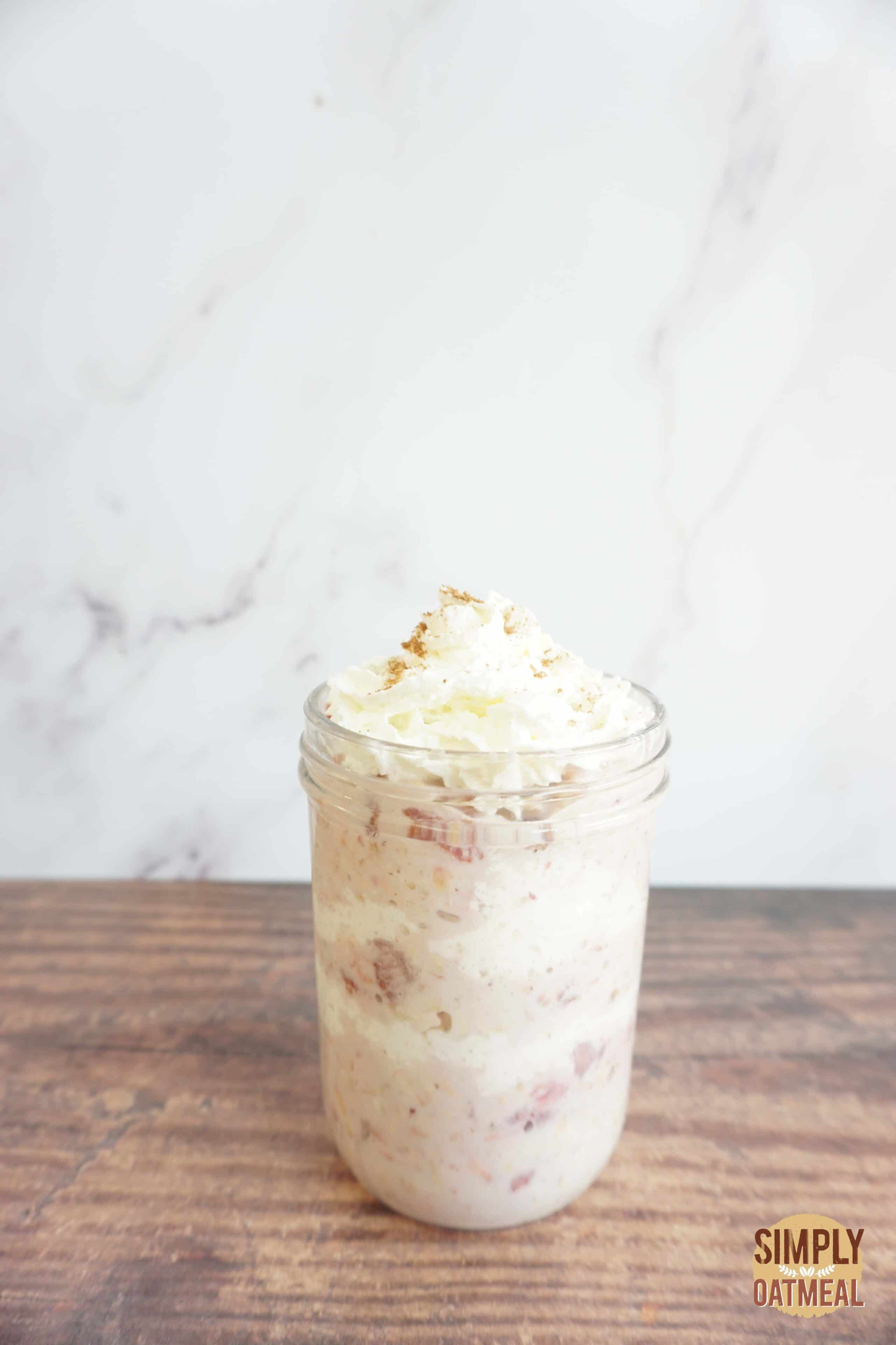 Single serving of strawberry and cream overnight oats in a mason jar