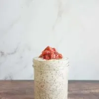 Single serving of strawberry rhubarb overnight oats in a mason jar