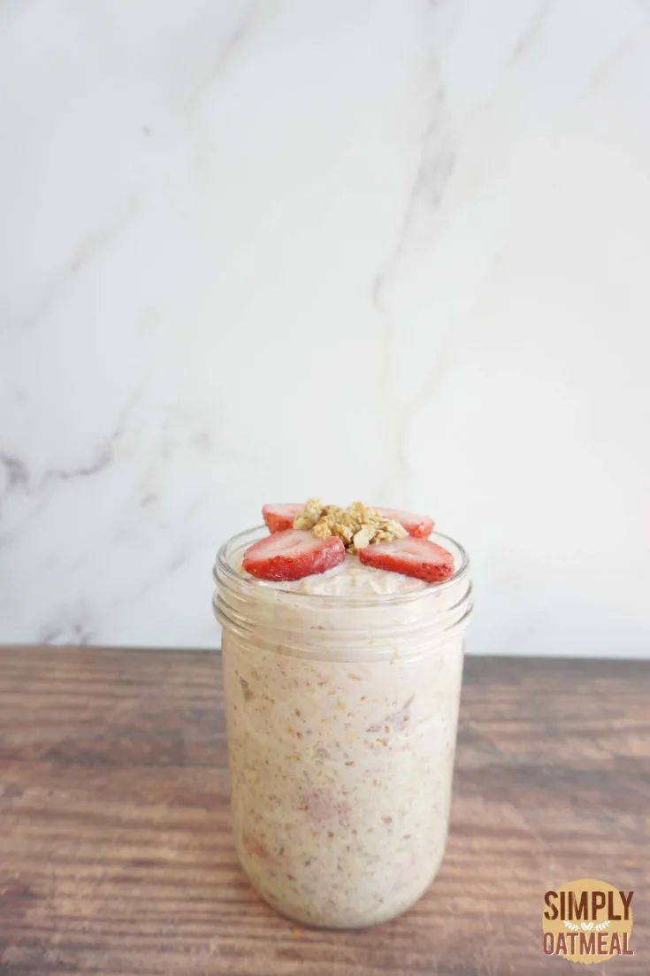 Single serving of strawberry yogurt overnight oats in a mason jar