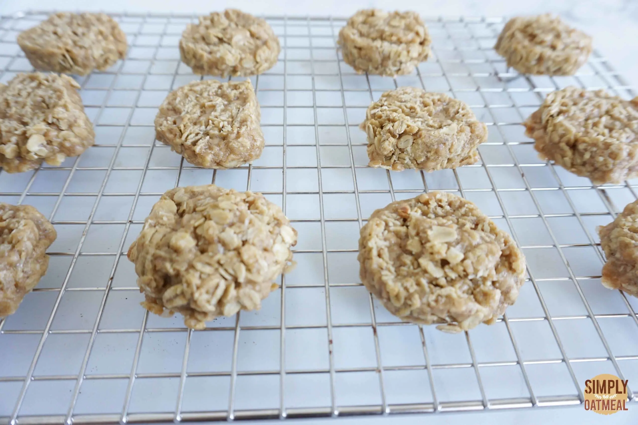 Hot toffee coconut oatmeal cookies cooling on a wire rack
