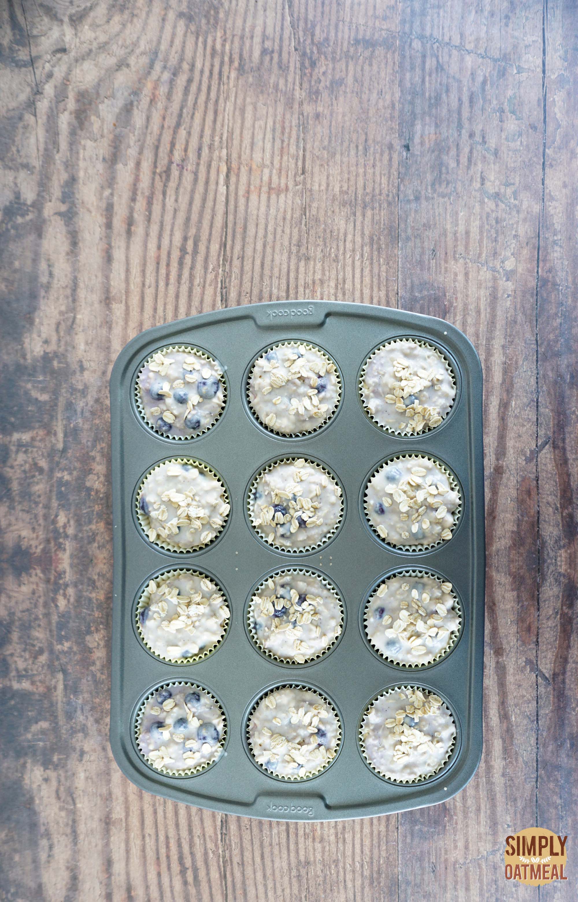 Blueberry lemon oatmeal muffins batter in a muffin pan