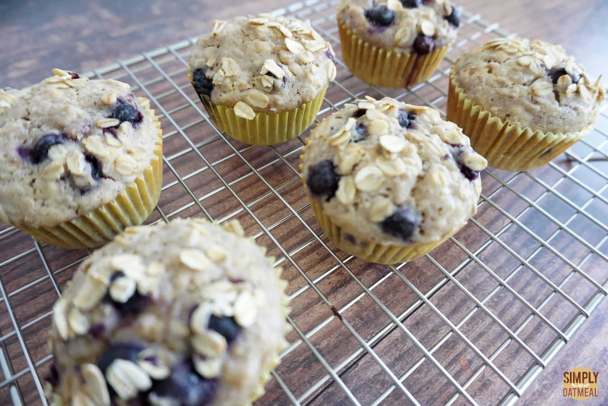 Blueberry lemon oatmeal muffins cooling on a wire rack