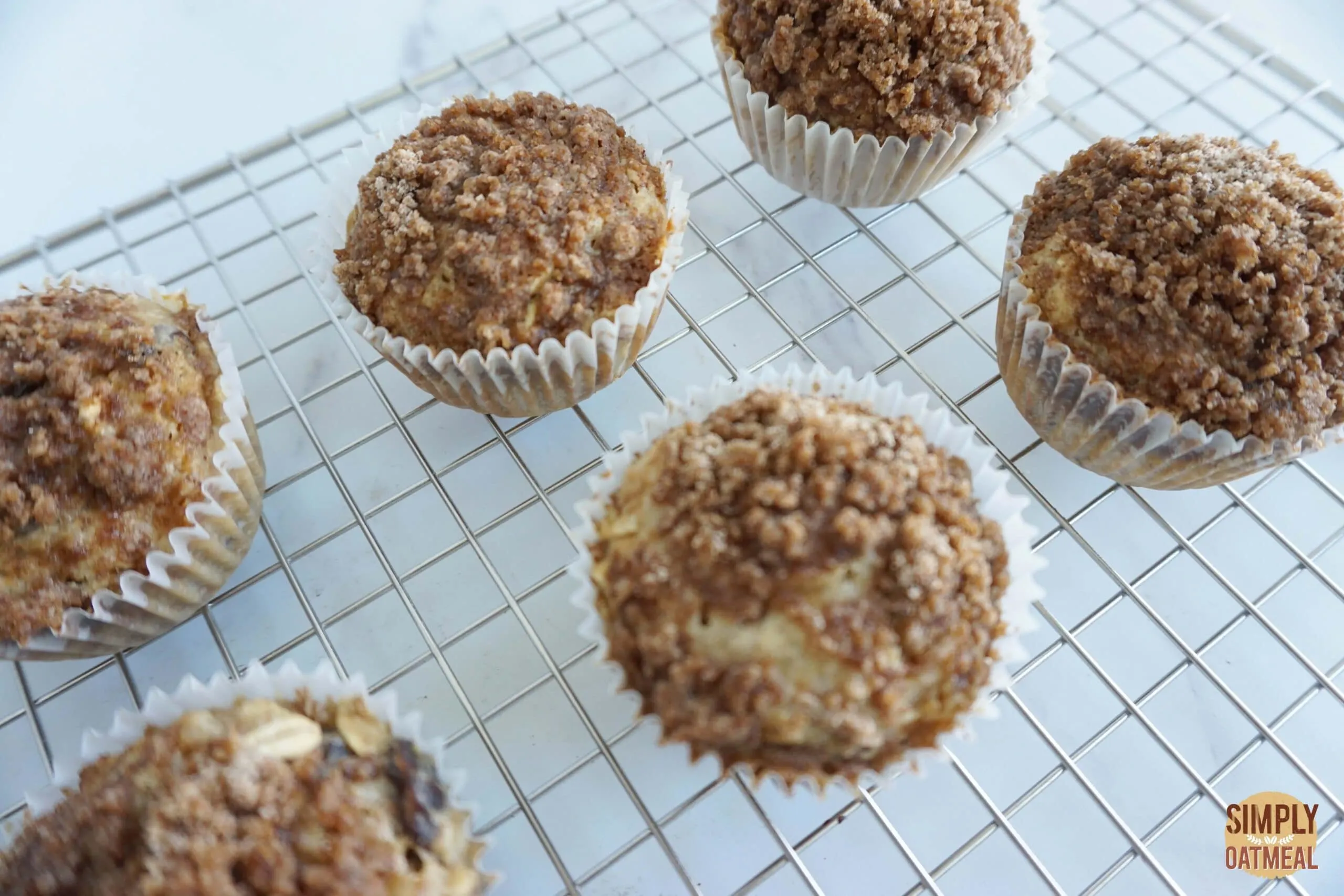 Cinnamon streusel oatmeal muffins cooling on wire rack