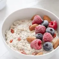 How do you reduce phytic acid in overnight oats. Bowl of soaked oats with almonds and berries on top