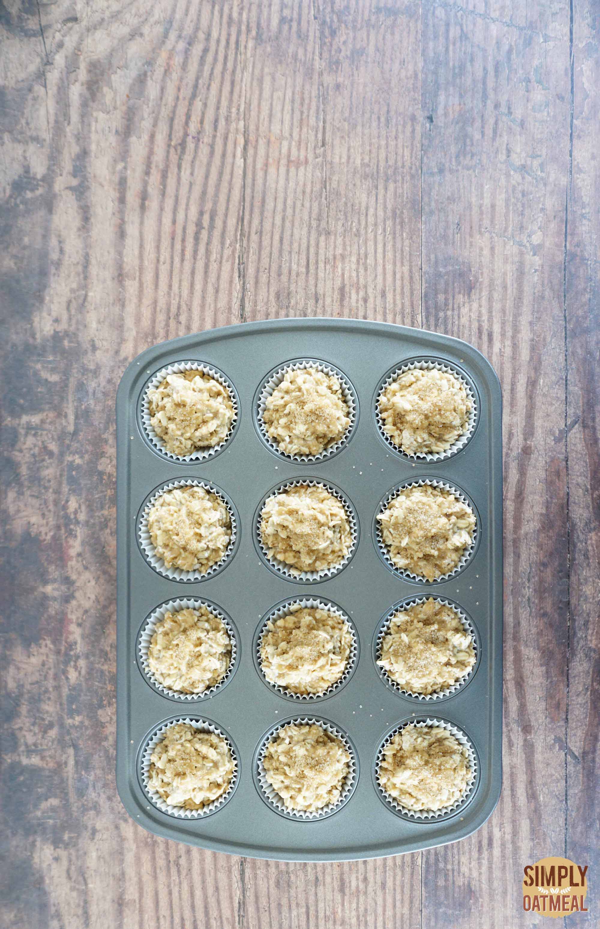 Maple brown sugar oatmeal muffins batter in a muffin pan
