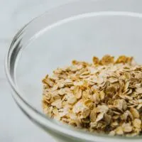 Rolled oats in a clear glass bowl