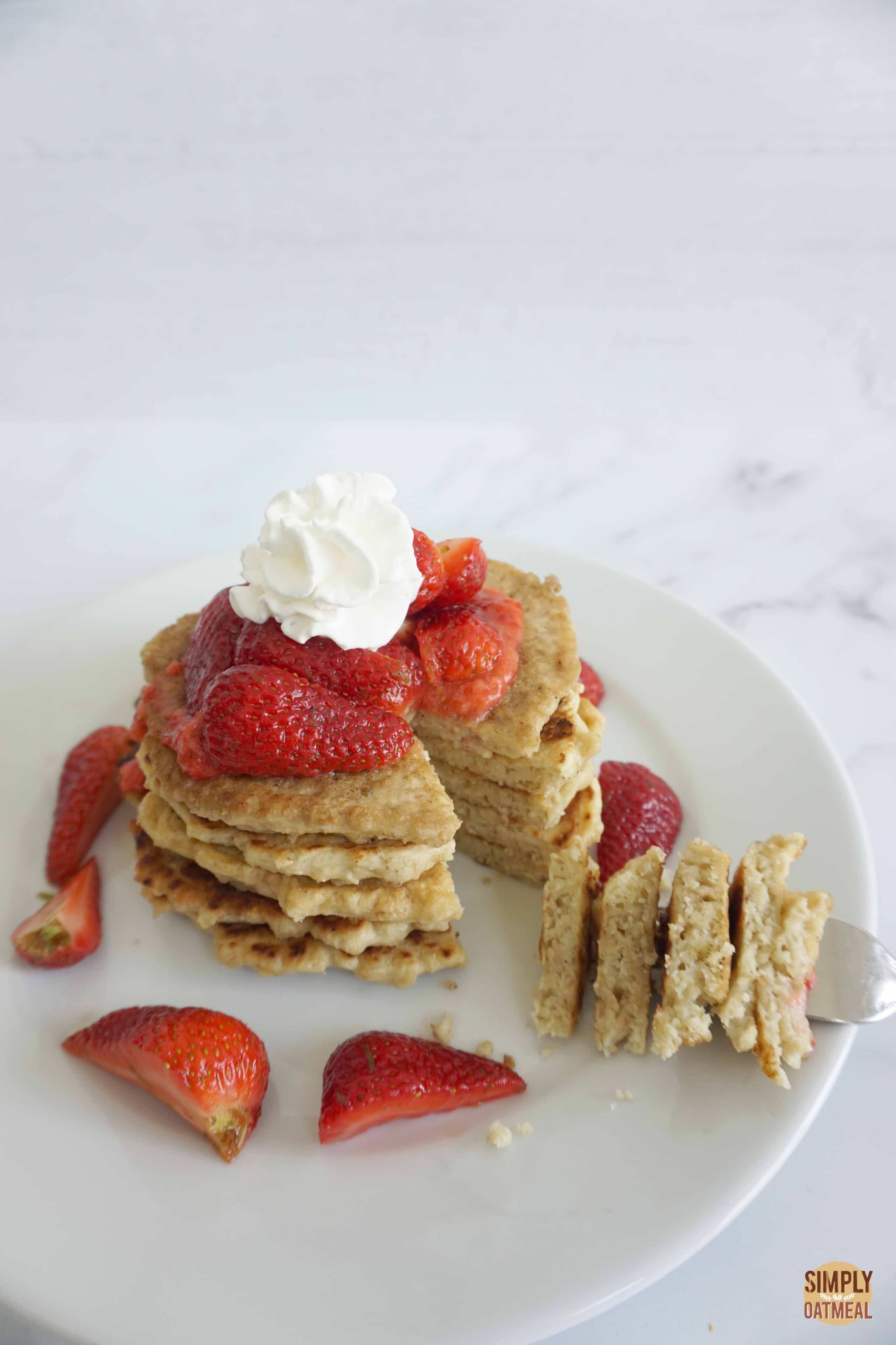 Cooked coconut oatmeal pancakes on a plate.