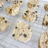 Hot blueberry lemon oatmeal cookies cooling on wire rack.