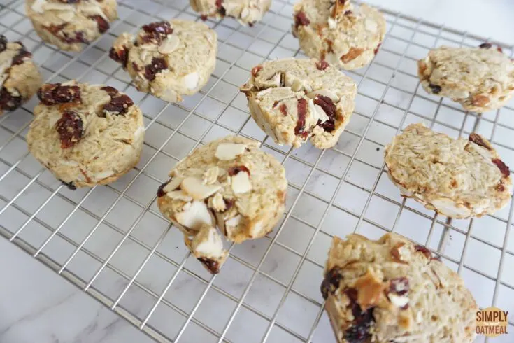 Hot cranberry almond oatmeal cookies cooling on wire rack.