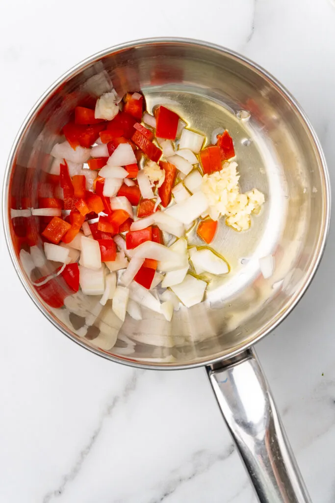 Garlic and veggies in pan.