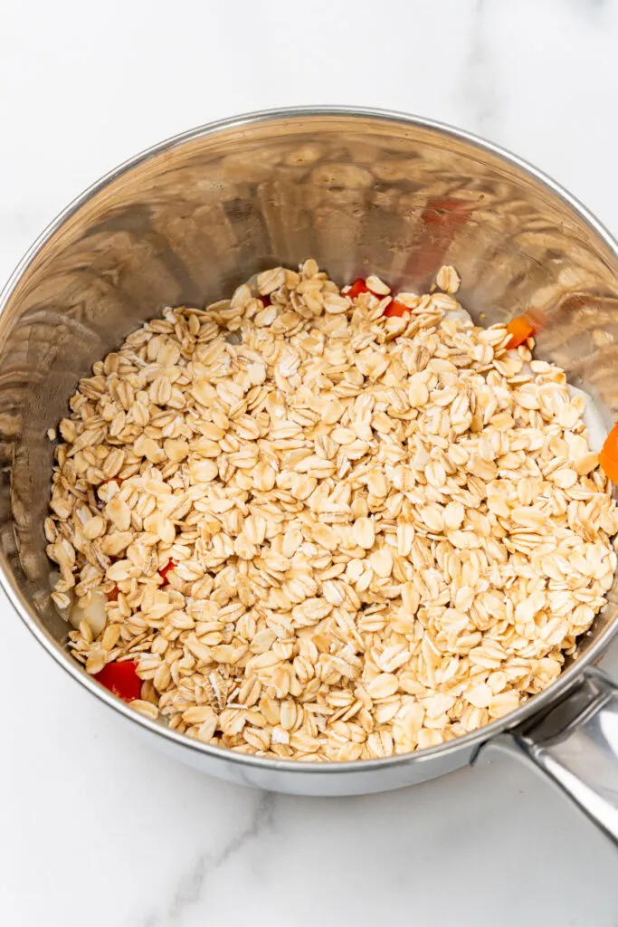 Dry oats in pan.